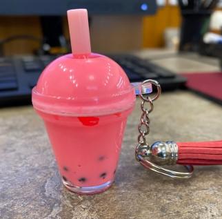 mini bubble tea in a plastic container with a straw