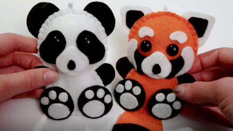 2 mini stuffed animal pandas that appear hand sewn