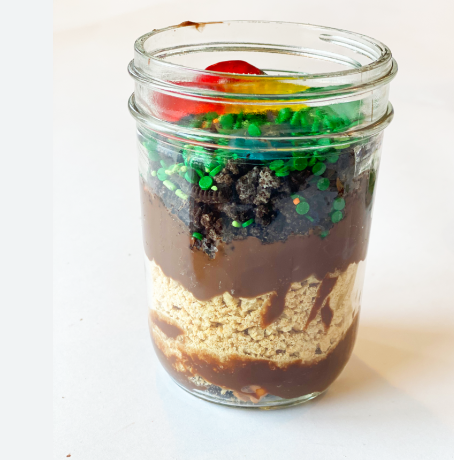 Jar with pudding cake and candy worms