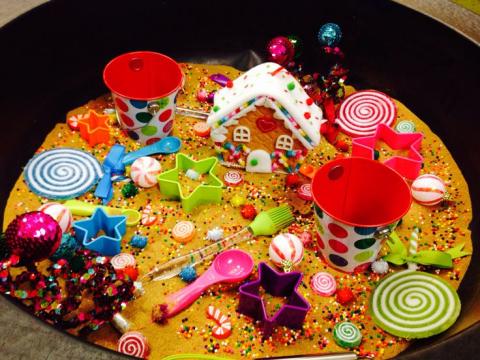 Sensory toy bin with candy land theme
