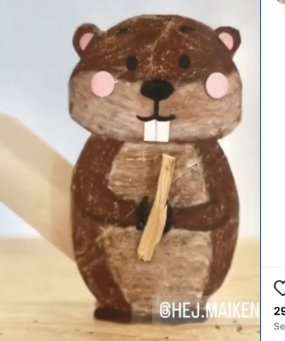 Beaver hold a piece of wood