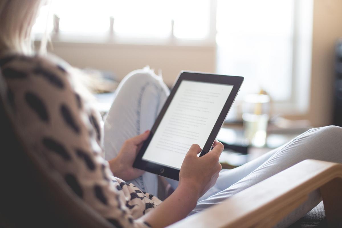 person reading an electronic reading device