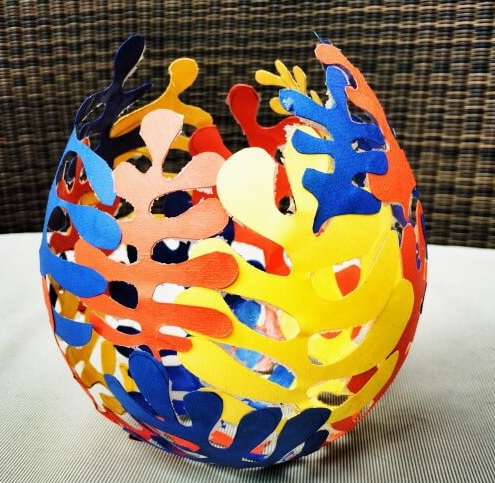 Multi colored shapes forming a vase