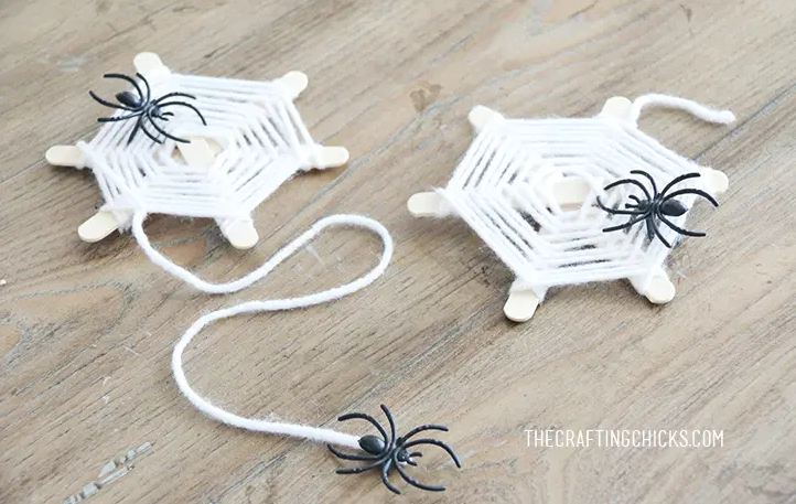 spider web craft with black plastic spider