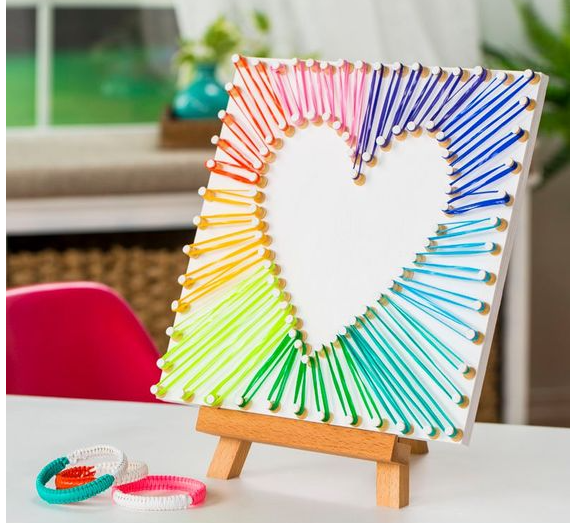 Heart shaped string art on canvas