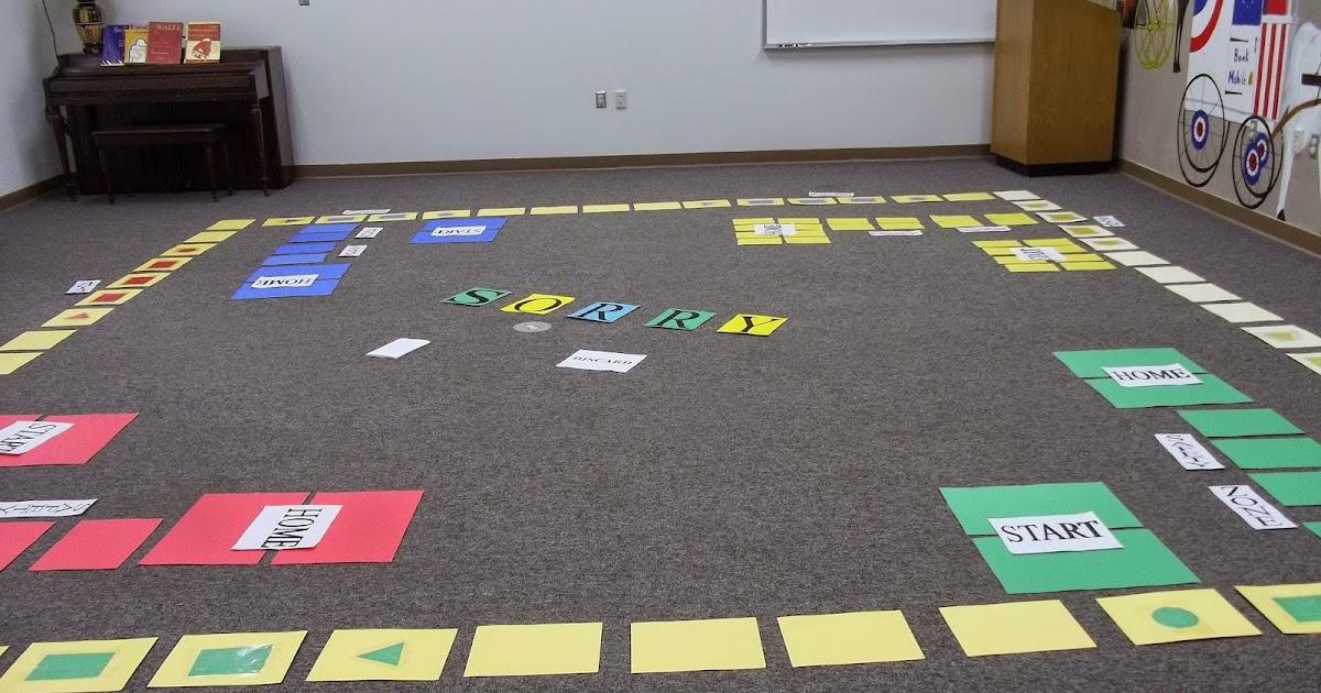 A giant sorry game placed on the carpet