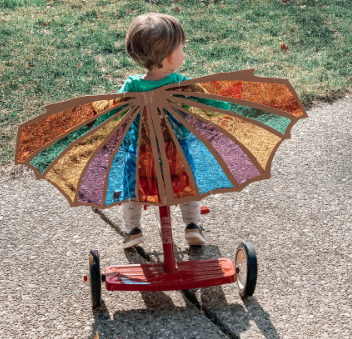 Child on tric with dragon wings