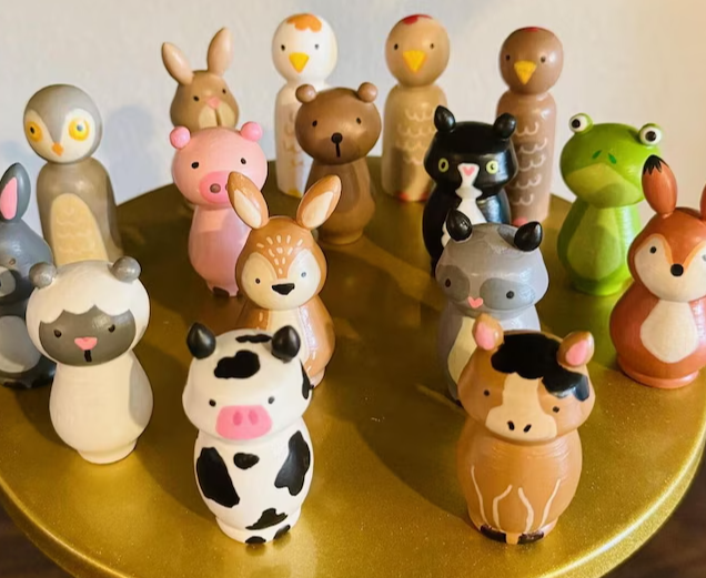 Various animals painted on peg dolls